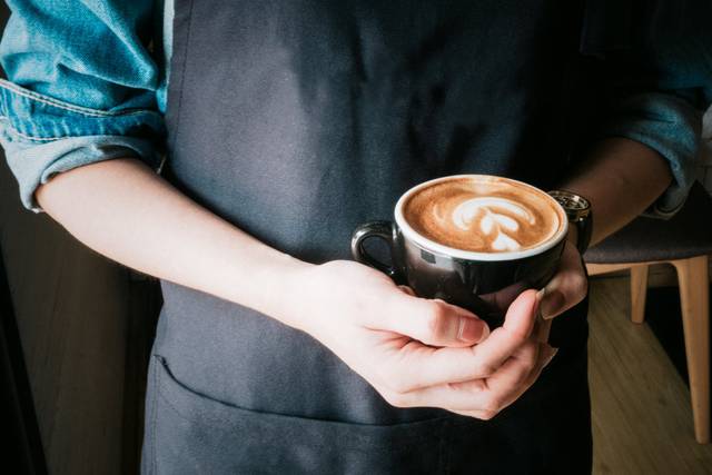 Barista showing an espresso