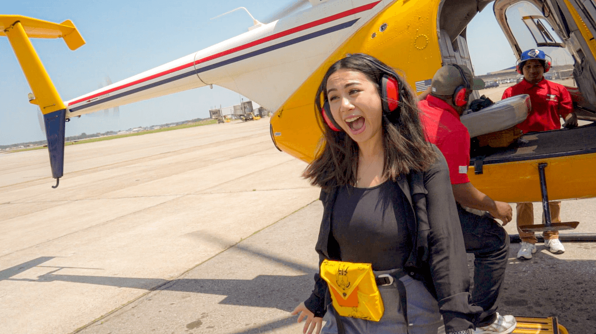 Excited woman after helicopter ride.