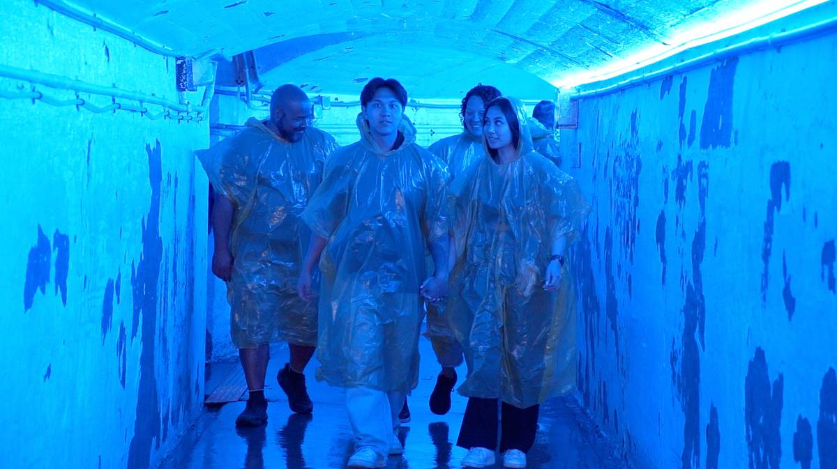 People in Journey Behind Falls tunnel tour.