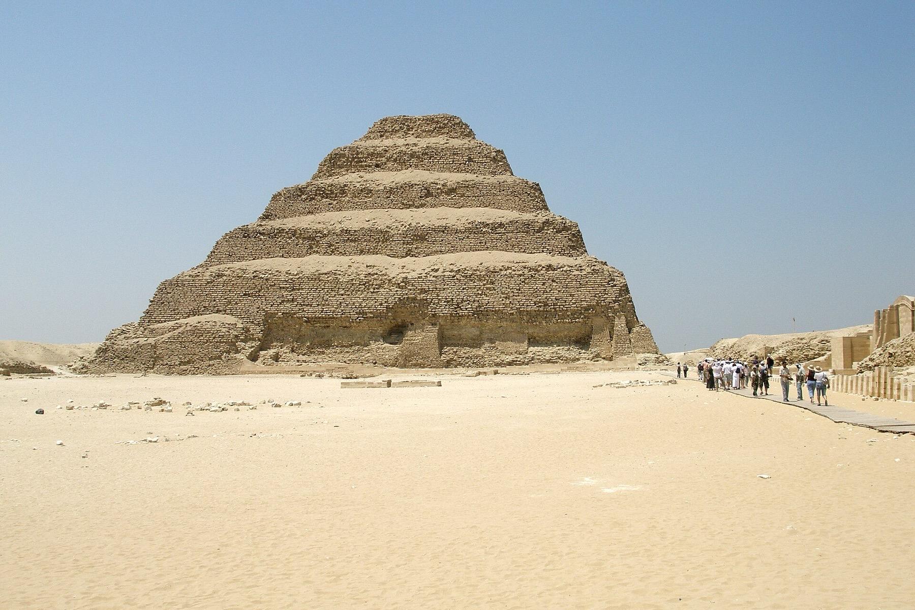 The six stepped tiers of the Pyramid of Djoser rising from the sand at Saqqara