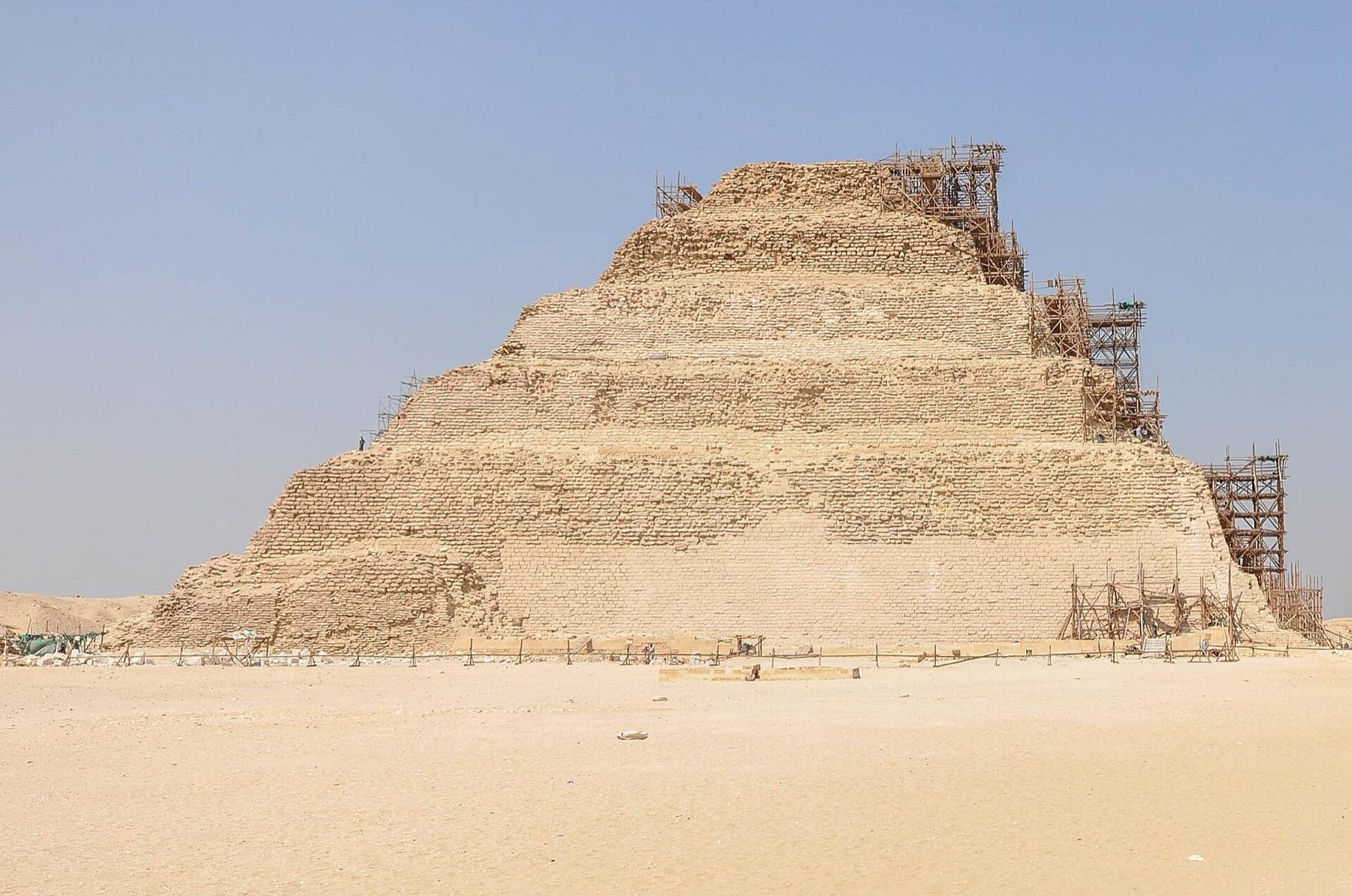 The six stepped tiers of the Pyramid of Djoser rising from the sand at Saqqara