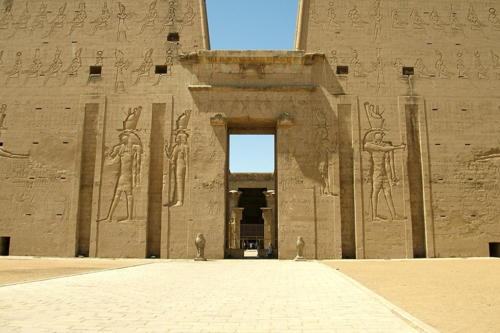 The carved gateway of the pylon at the Temple of Horus, Edfu, with figures of Horus on either side