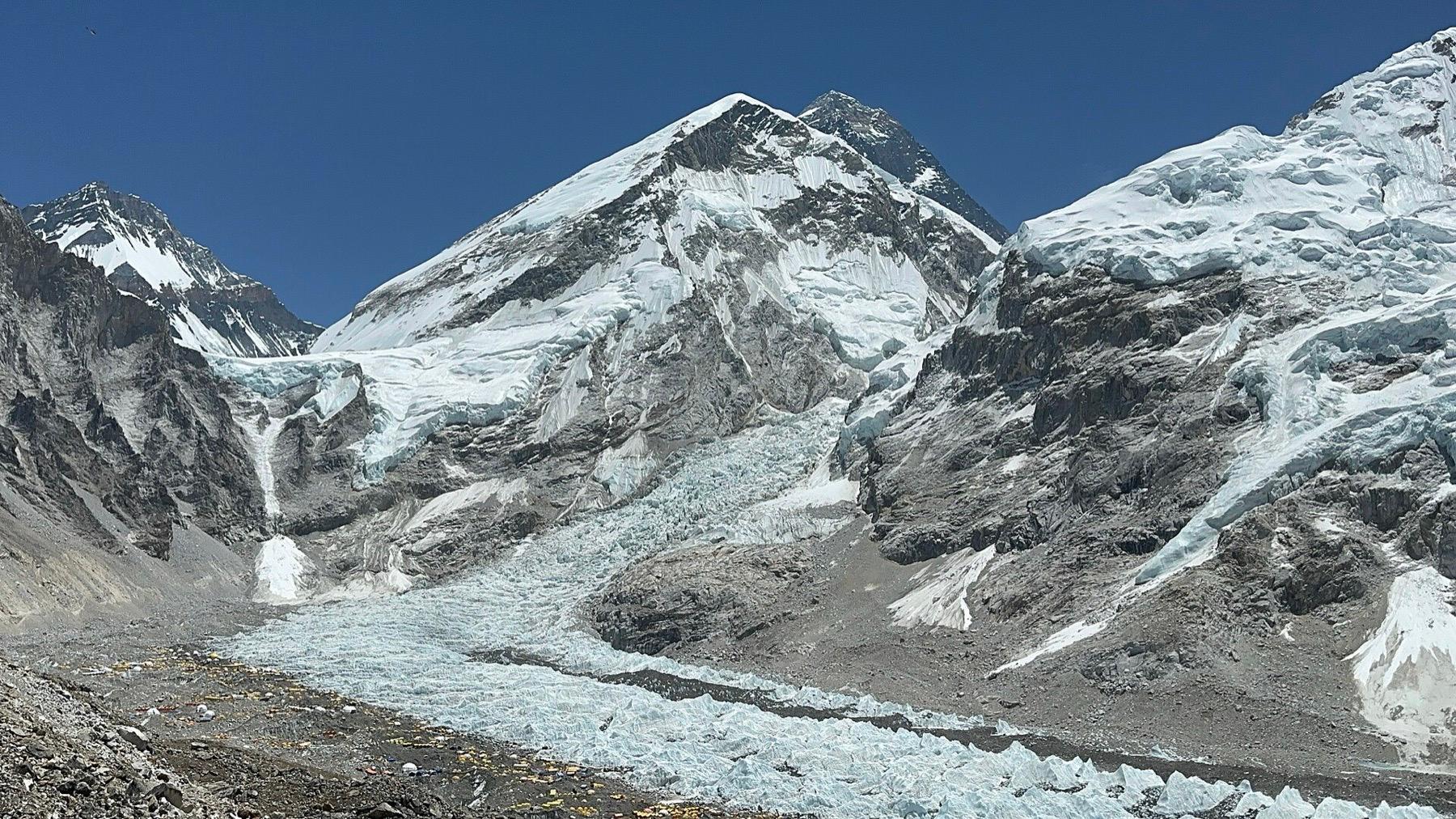 The Khumbu Icefall tumbling down between Everest's west shoulder and Nuptse above the rocky glacier at base camp