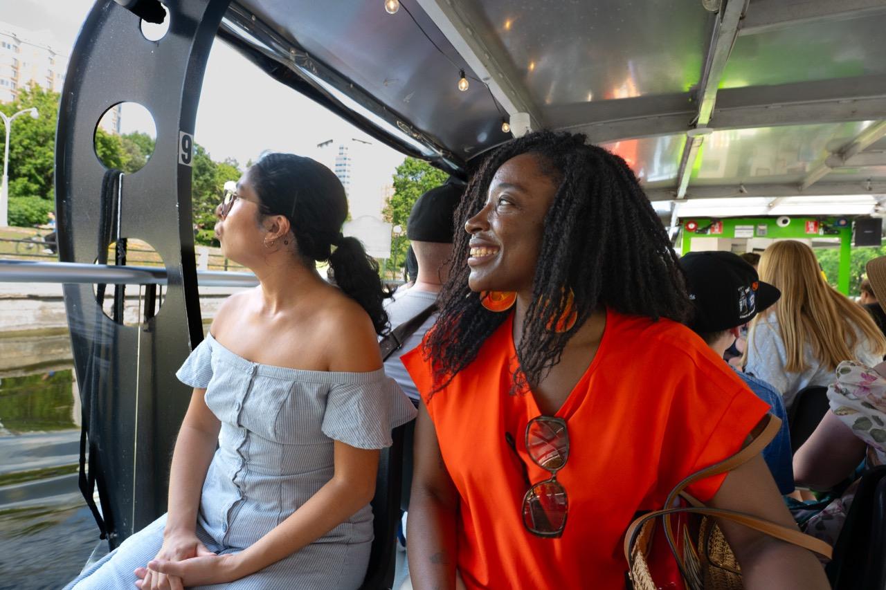Guests smiling on a boat cruise in Ottawa