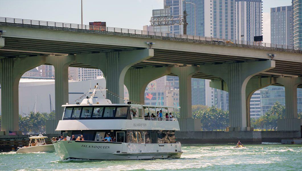Miami-Island-Queen-tour-boat-with-view-of-bridge-and-Downtown-Miami-in-background.jpg