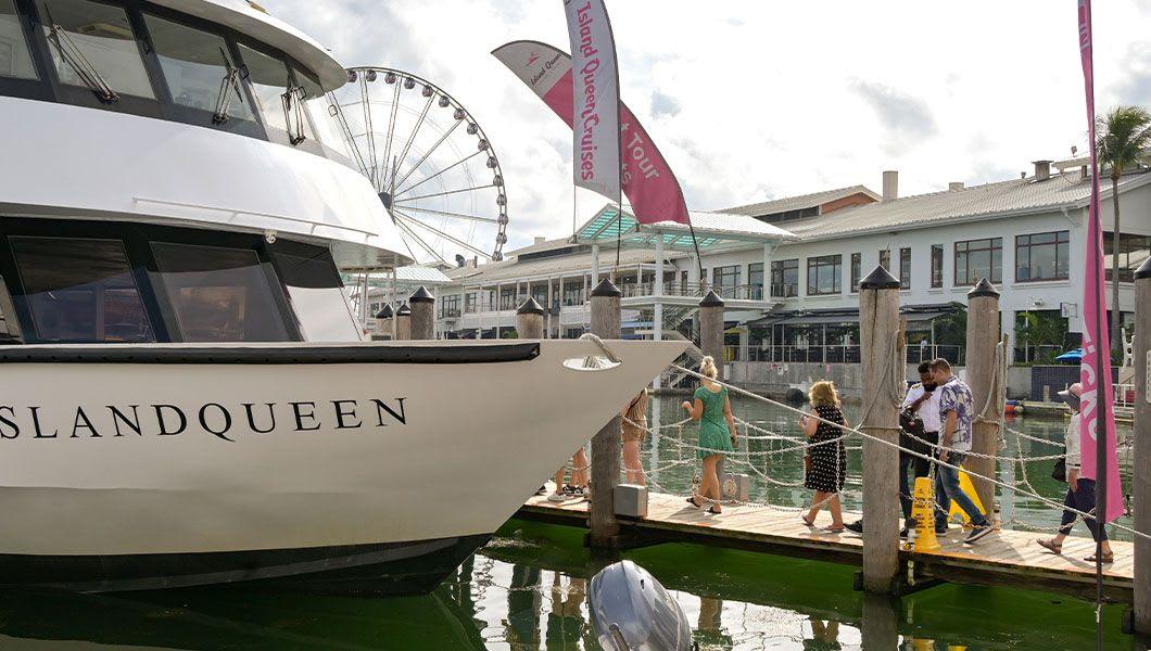 People-boarding-a-tourist-sightseeing-boat-for-a-cruise-around-the-bay-and-harbour.jpg