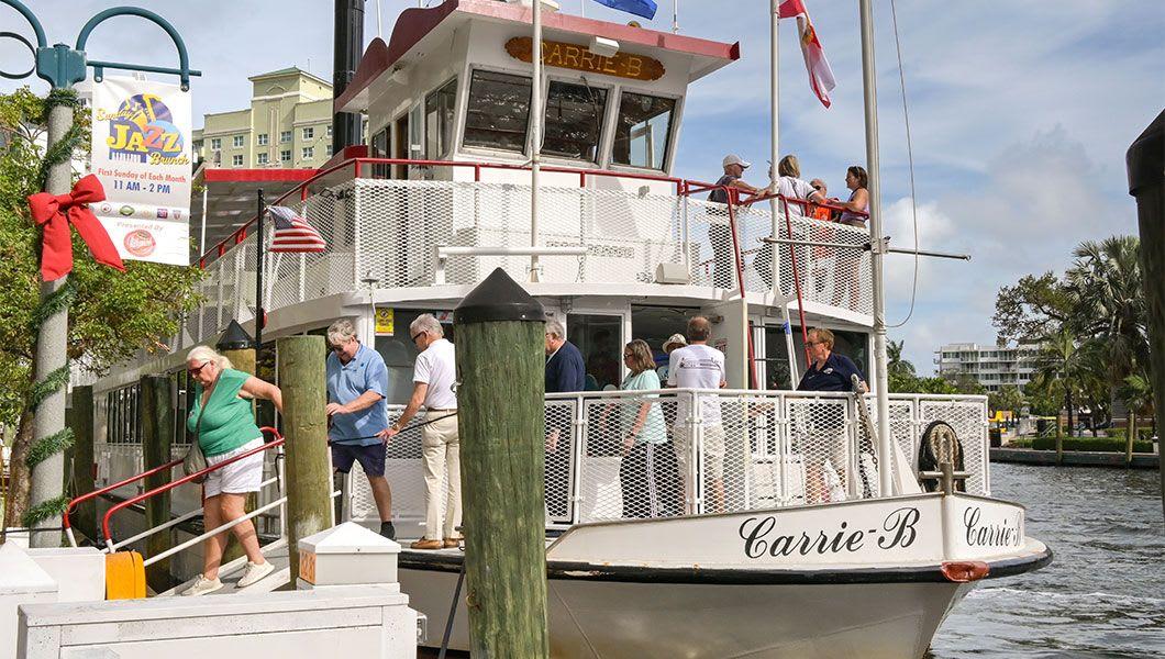 People-getting-off-a-Carrie-B-cruise-boat-on-the-city's-waterfront.jpg