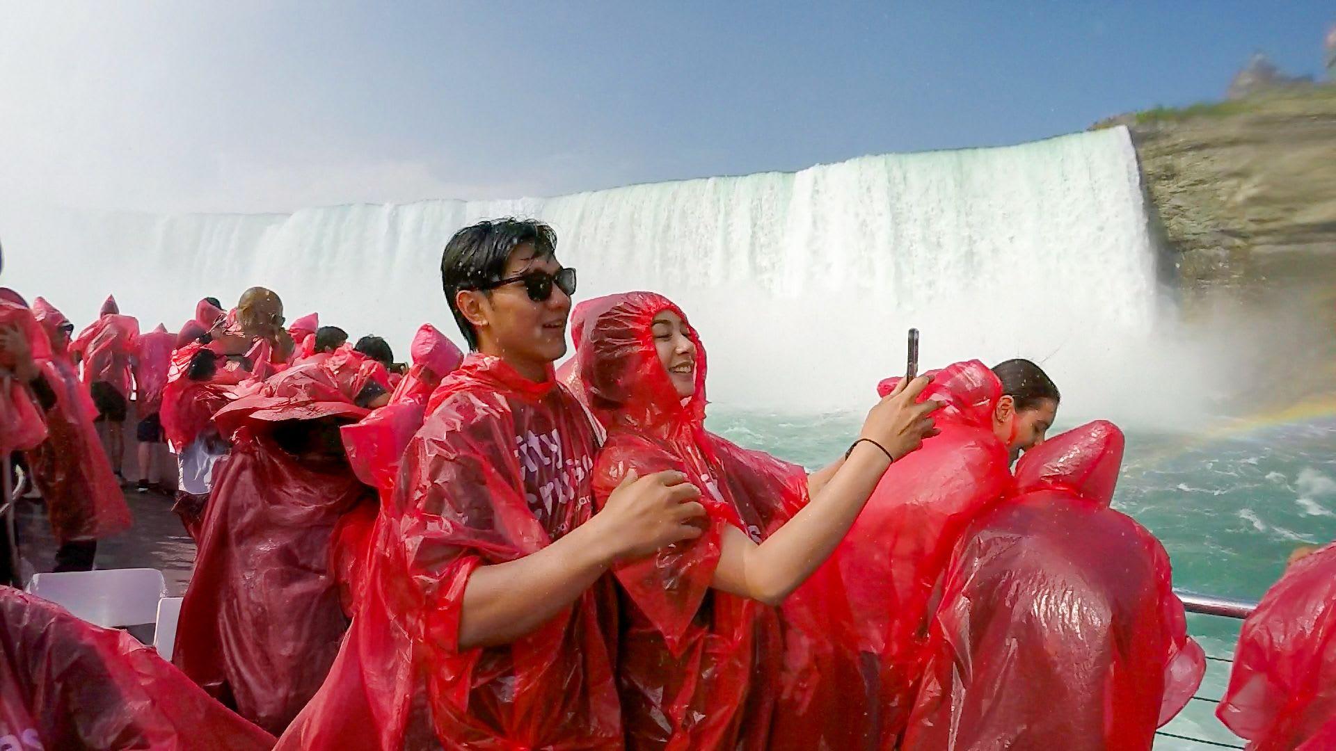 Couple enjoying Hornblower cruise at Niagara Falls