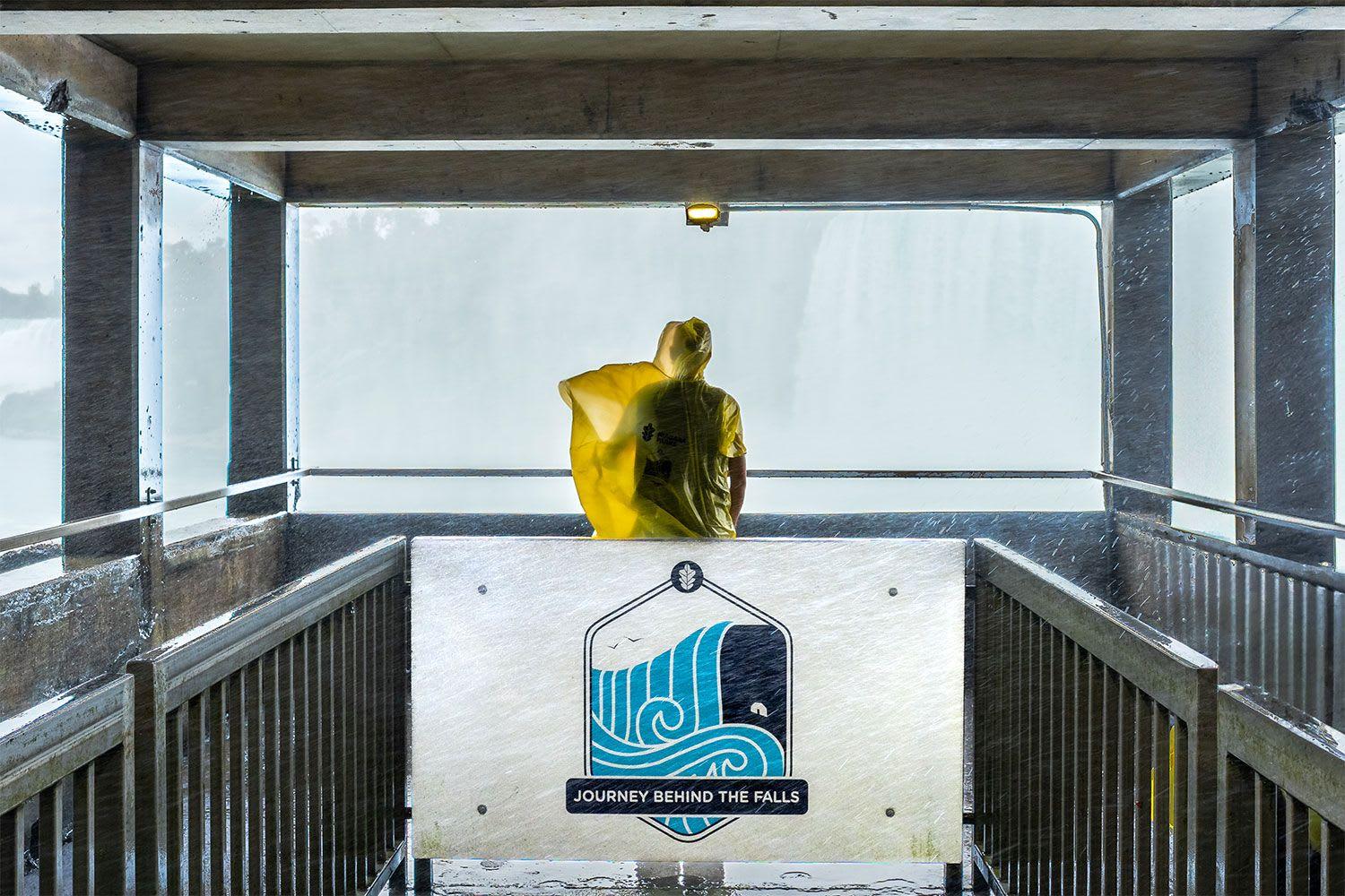 A person wearing poncho is enjoying views of Niagara Falls from Journey Behind the Falls.