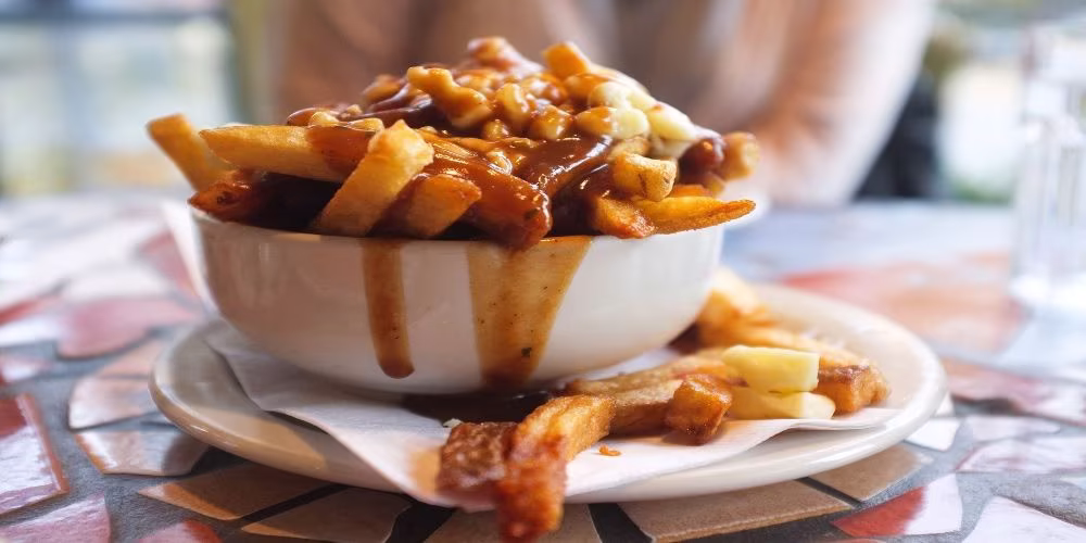 Enjoy Poutine with Montreal Mile End Staples Food Walking Tour.jpg