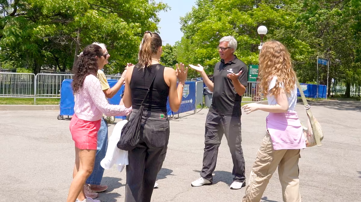 Tour guide talking with visitors on Niagara Falls tour.jpg