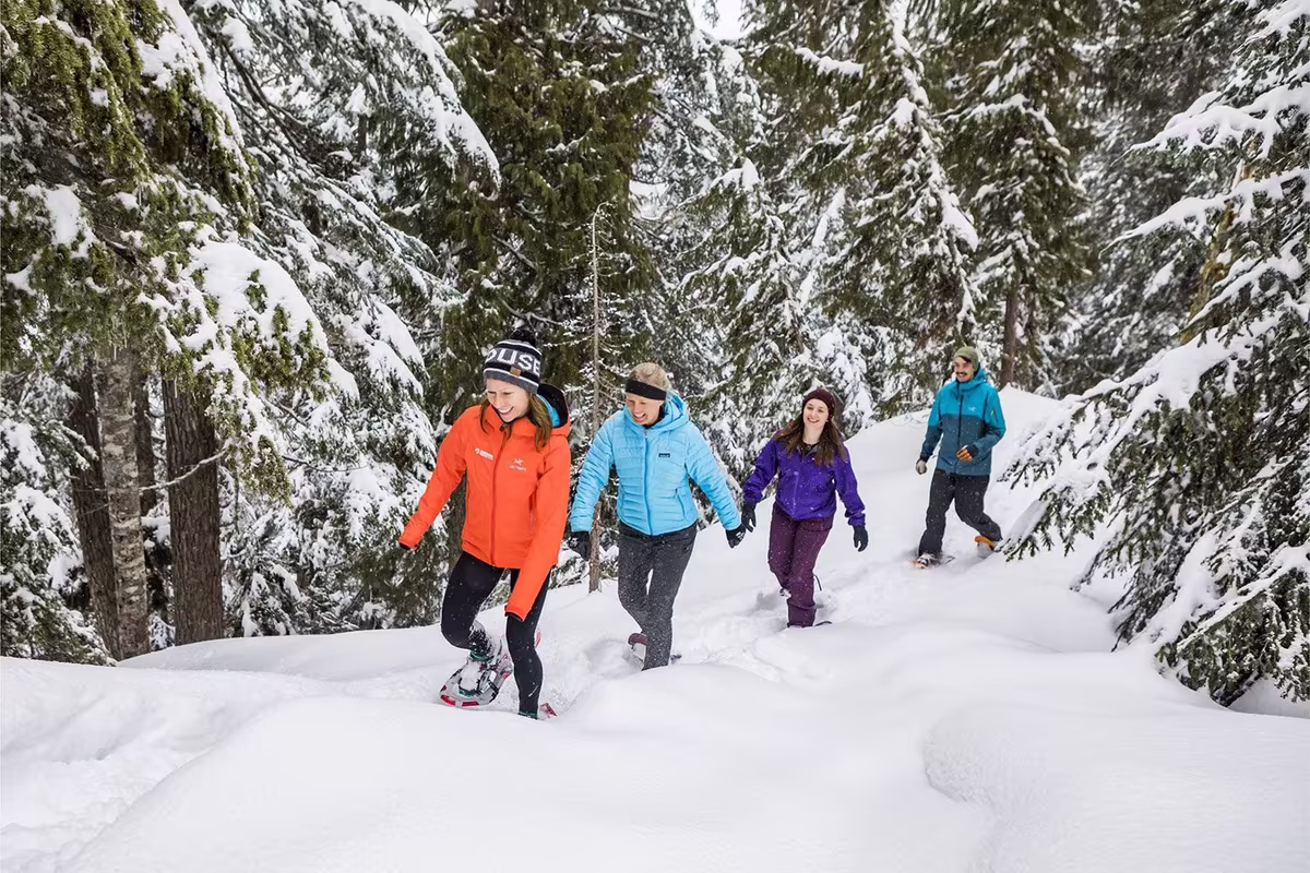 A group of friends snow shoeing at Grouse Mountain