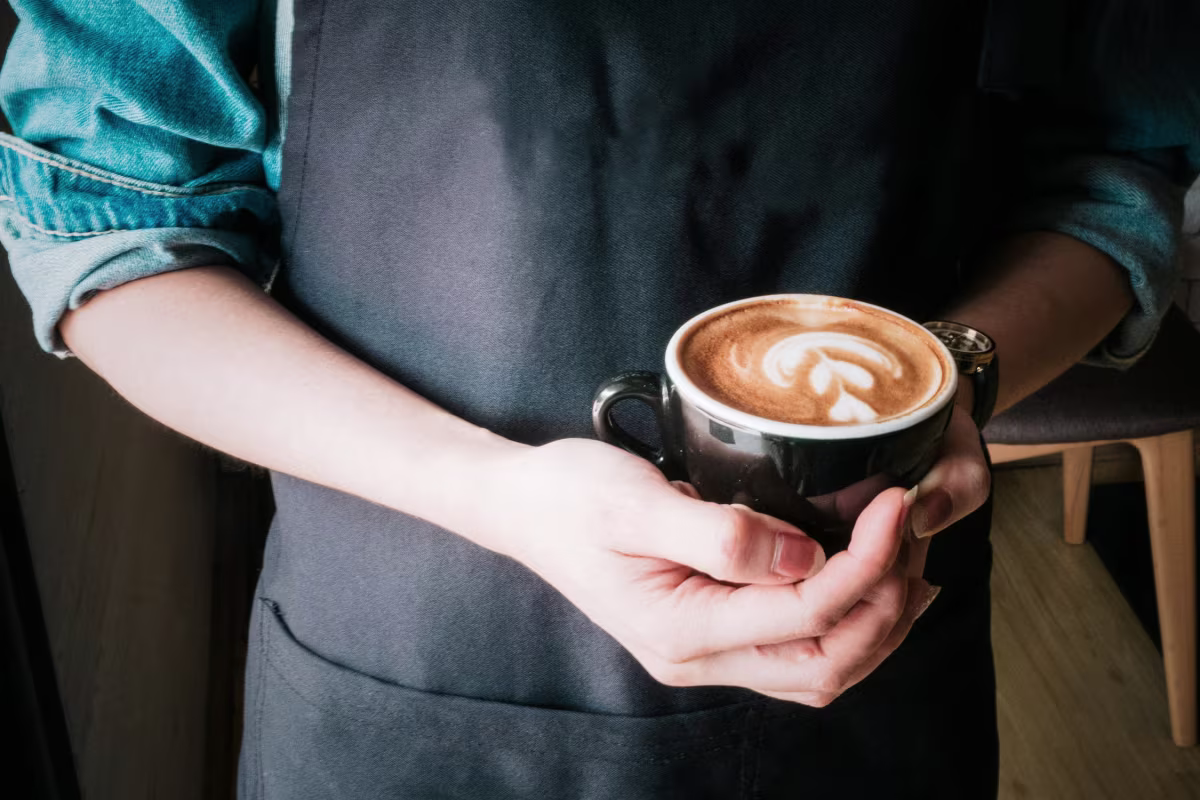 Barista showing an espresso