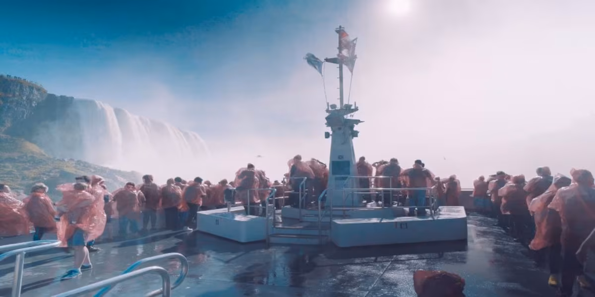 Tourists in red ponchos on Hornblower Niagara Cruise near the falls.jpg