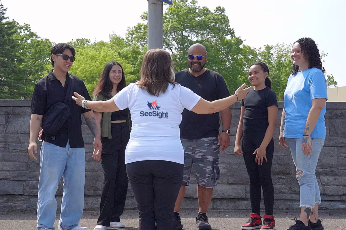 Friendly guide with visitors at Niagara Falls.