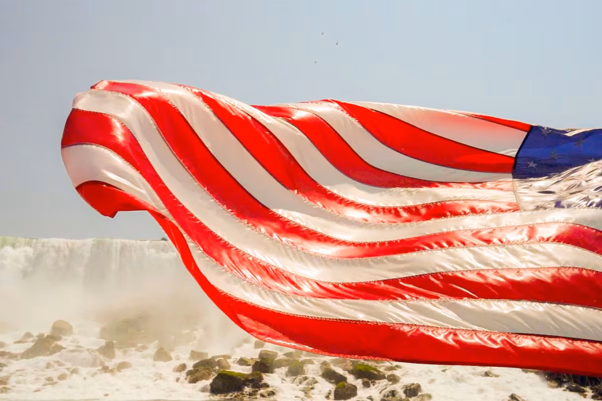 A wet American flag flies from the Maid of the Mist.