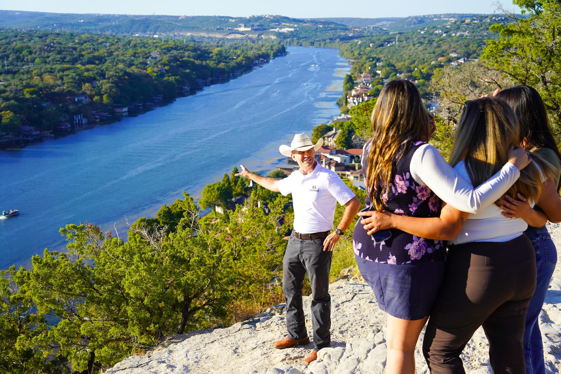 Guide and guests at the Mount Bonnell overlook in Austin