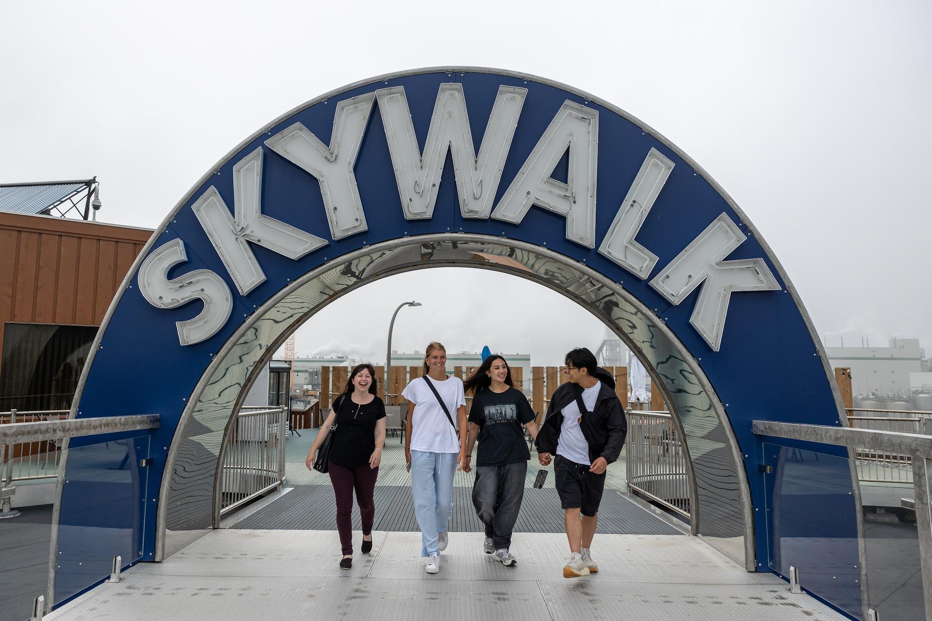 Guests walk through the Skywalk arch in Saint John