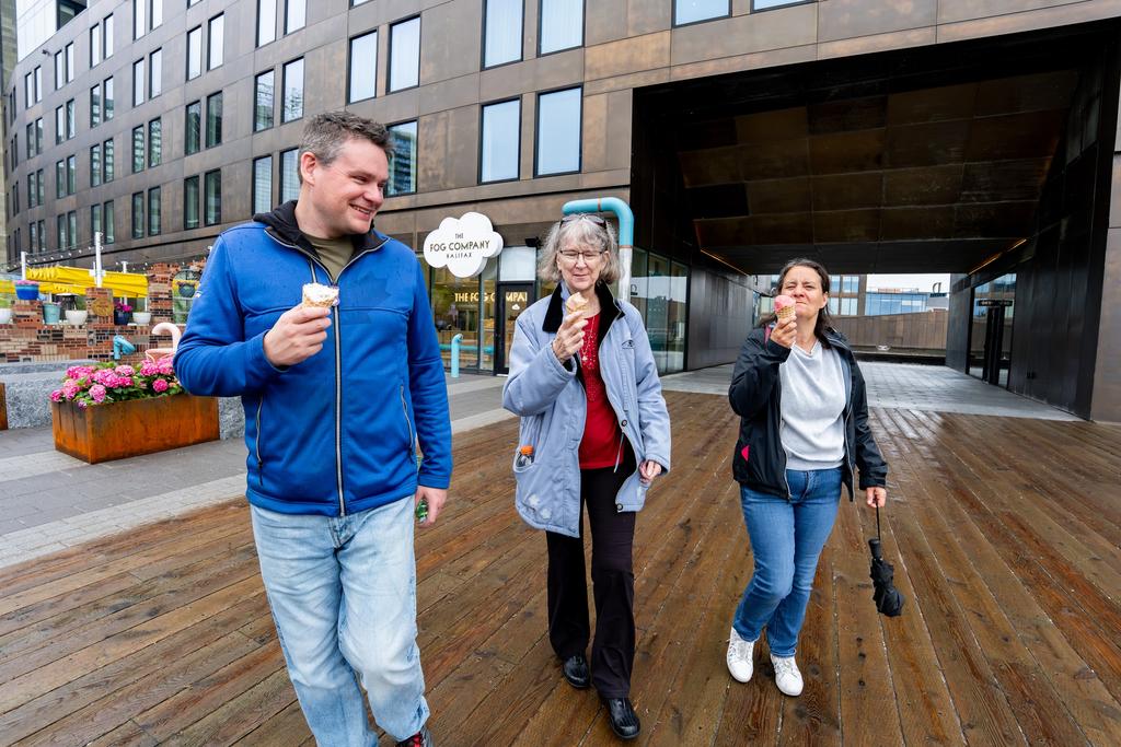 Guests walk the Halifax waterfront boardwalk
