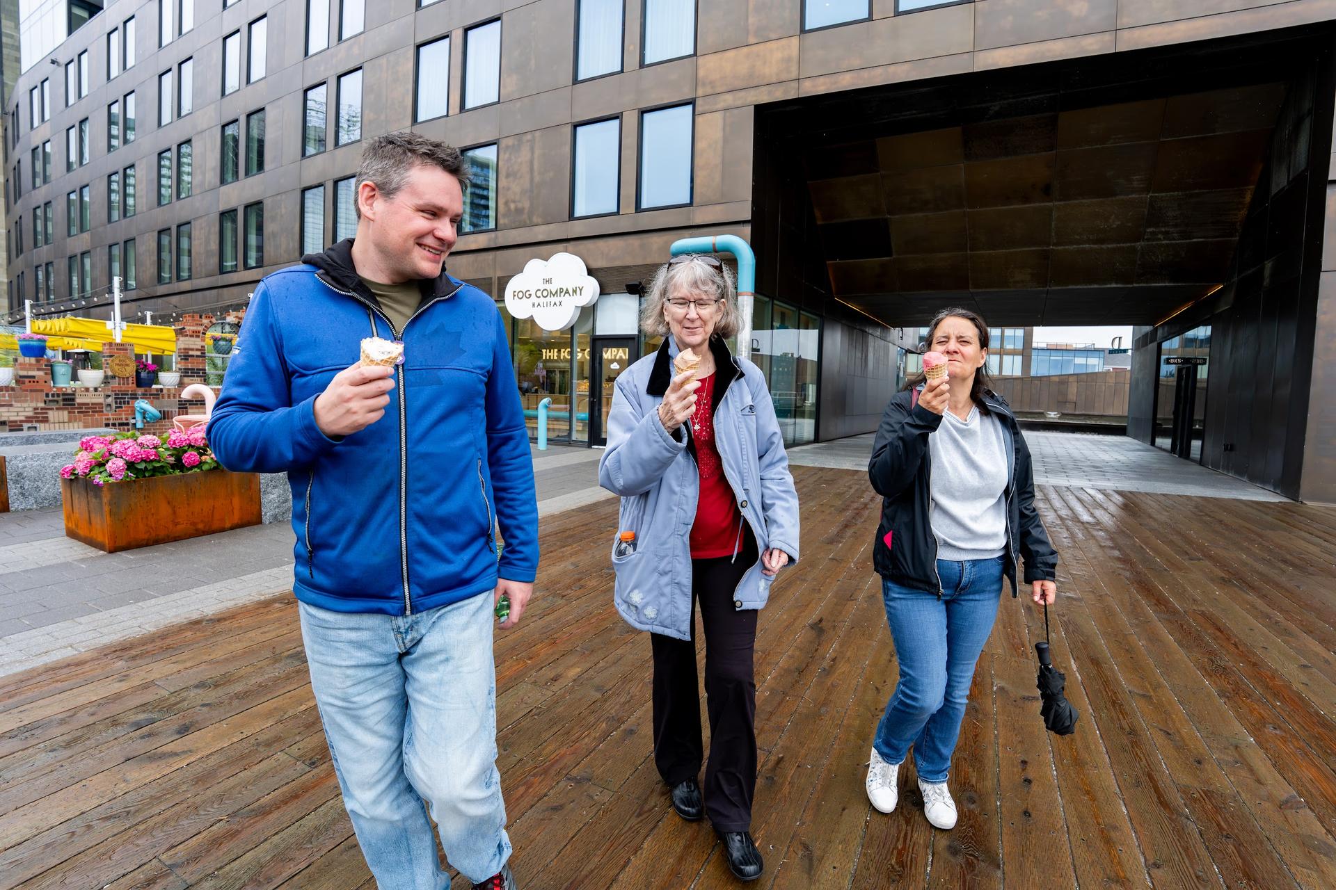 Guests walk the Halifax waterfront boardwalk