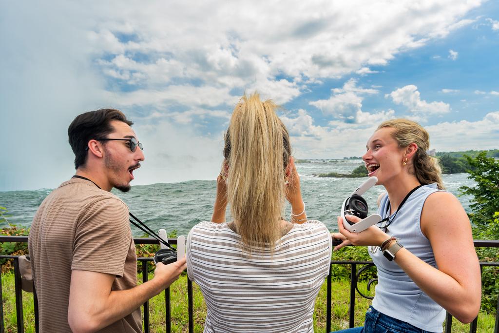 Guests try VR headsets beside the Niagara River